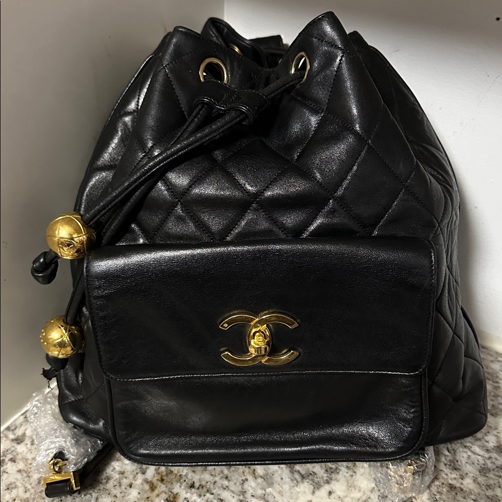 Chanel Black Quilted Leather Backpack with Gold Accents PRE-OWNED.
